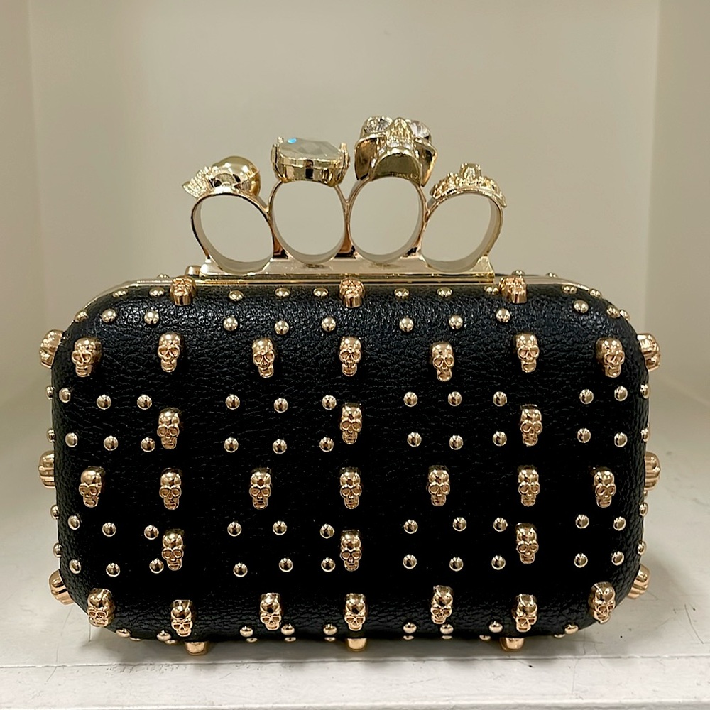 NWT knuckle clutch with skulls and studs